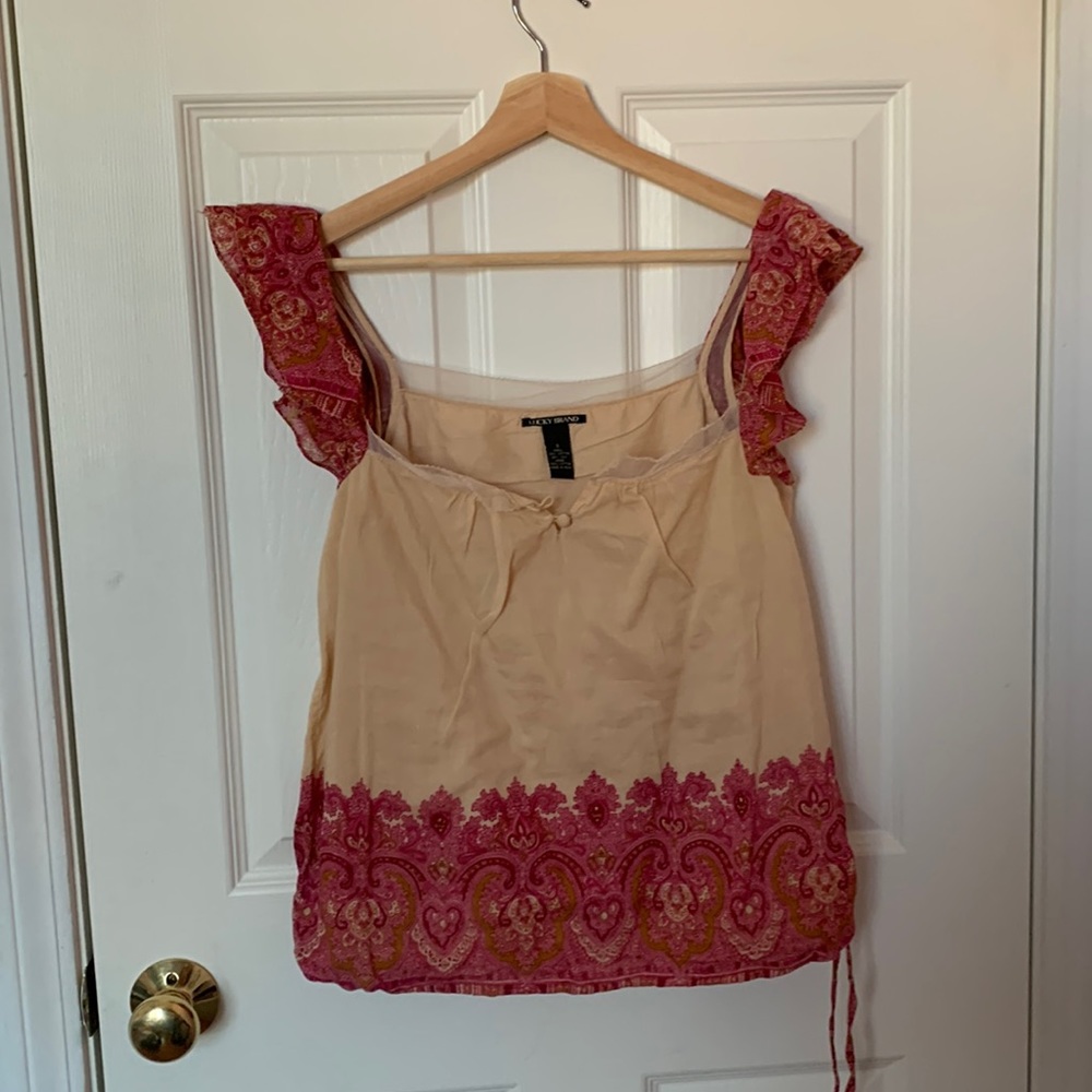Lucky Brand blouse with cinch tie at bottom, peachy body with pink accents